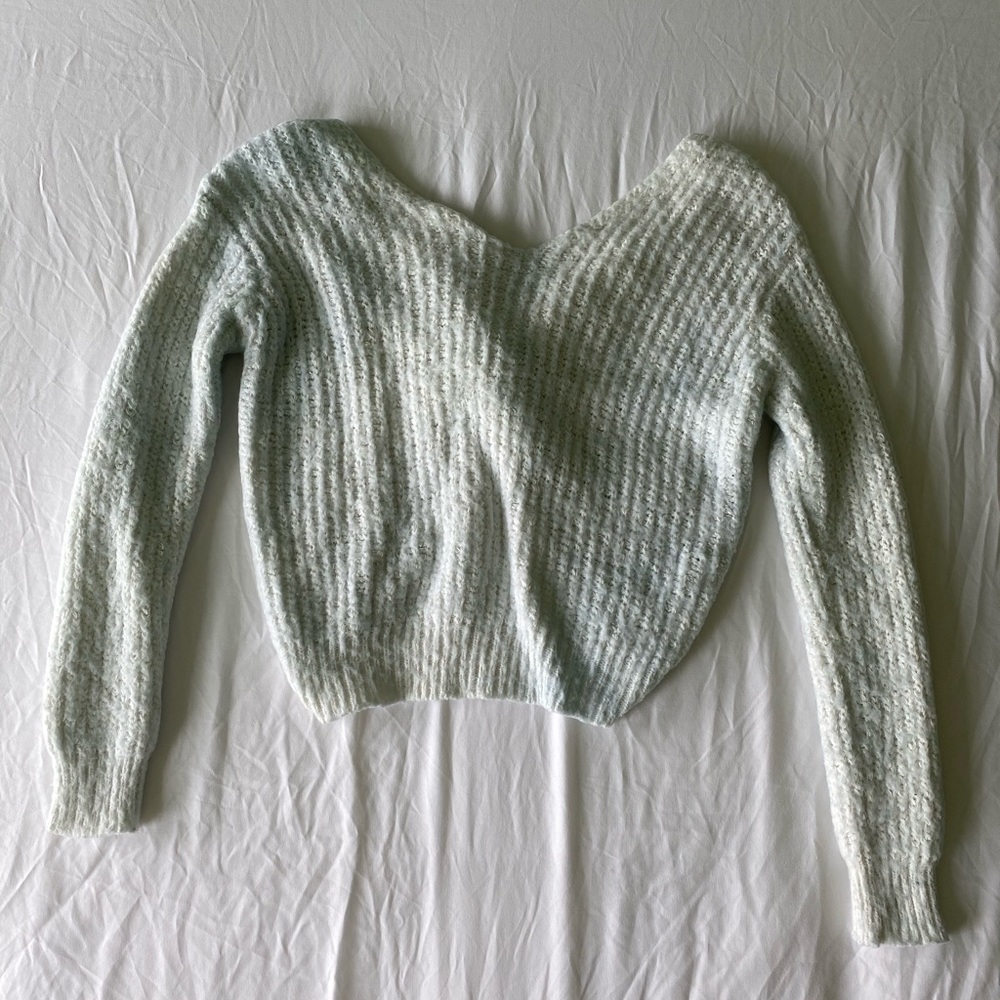 white twist-back sweater
